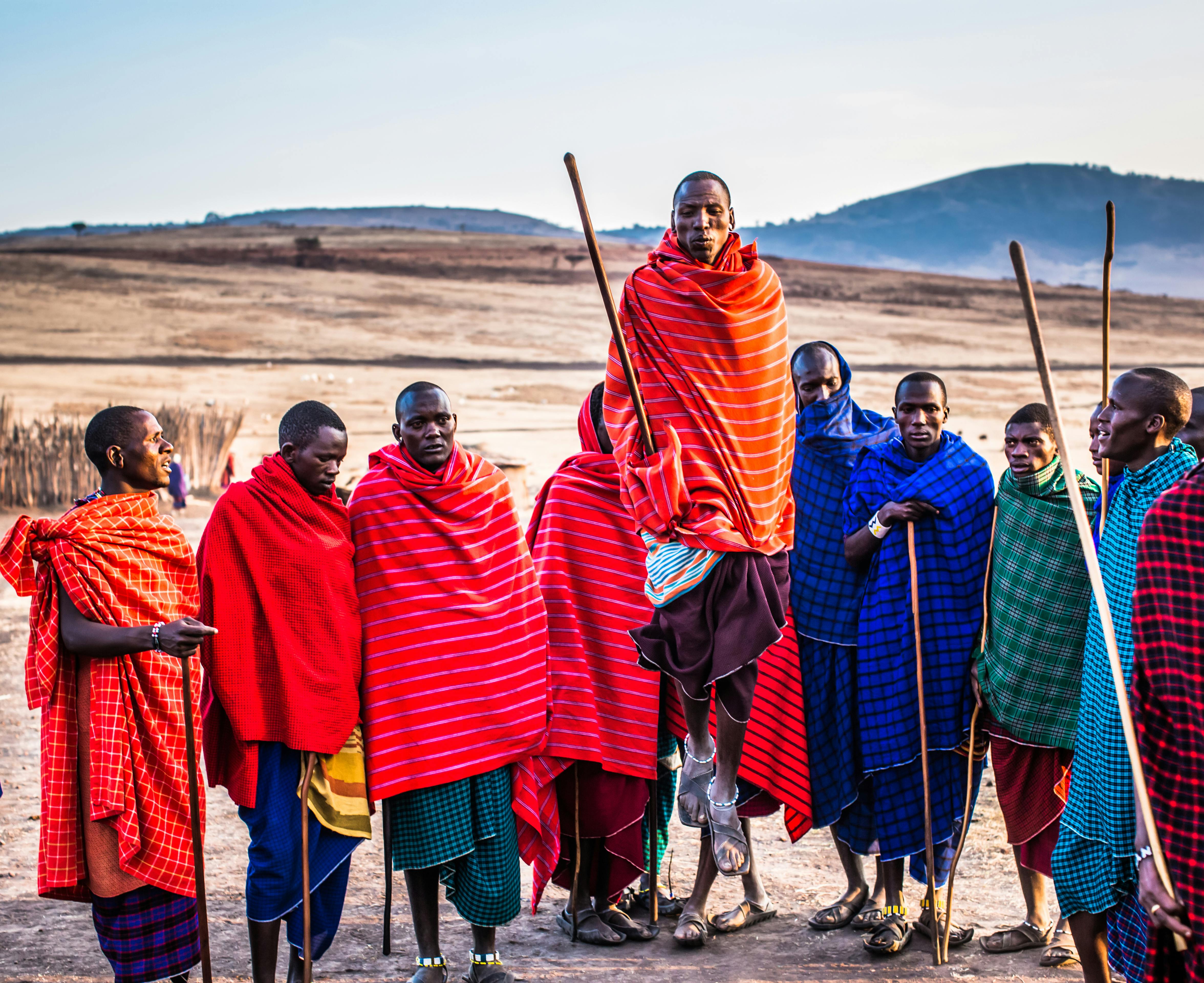 Masai Men wearing traditional clothing and demonstrating jumping skills